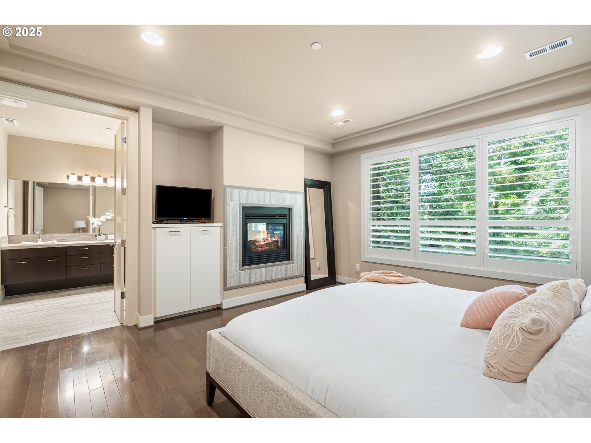 3425 Southwest 57th Avenue Portland, OR 97221 - Photo 8 of 33 a bedroom with a bed and a television