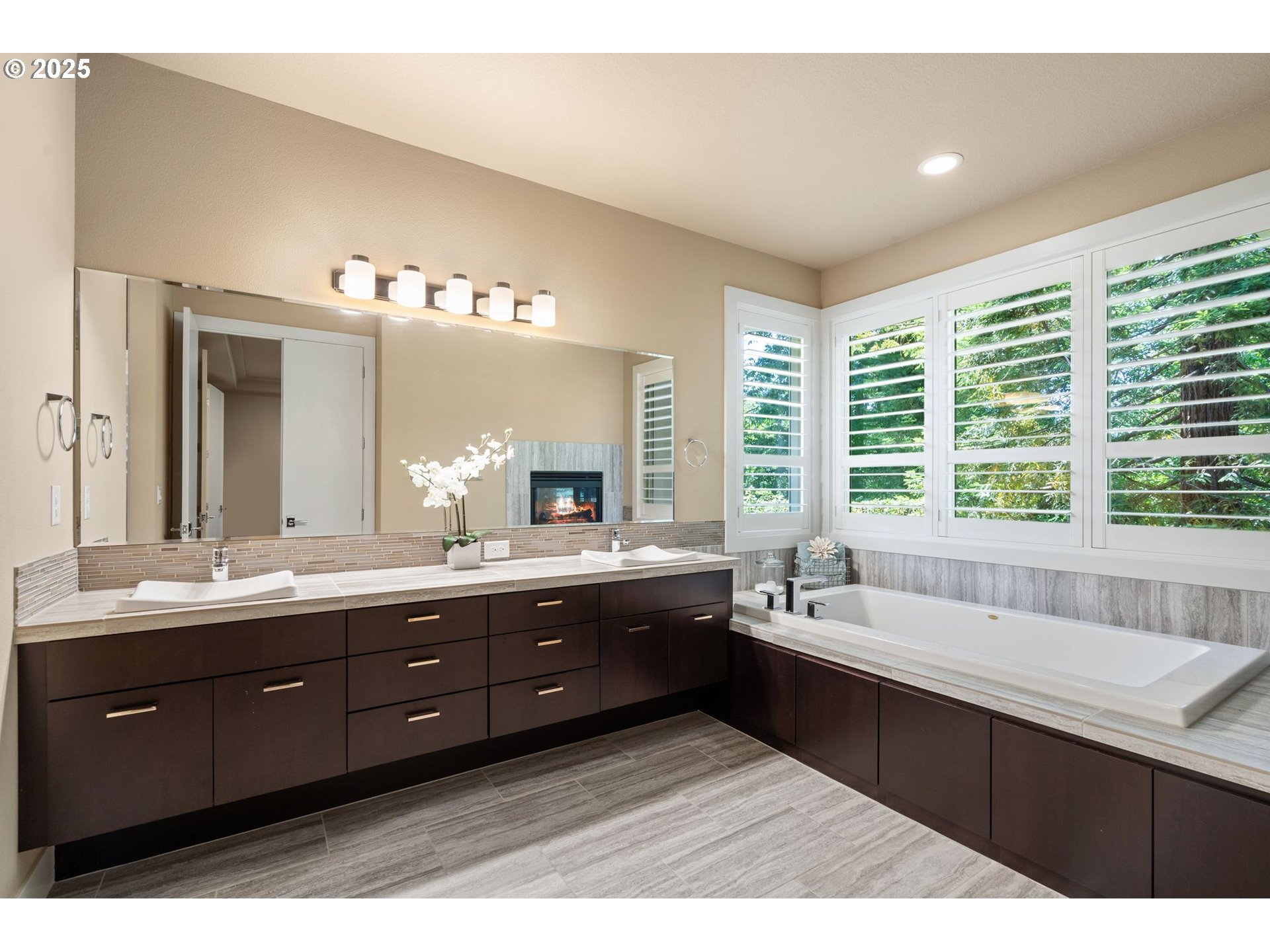 3425 Southwest 57th Avenue Portland, OR 97221 - Photo 9 of 33 a spacious bathroom with a sink mirror double vanity and bathtub