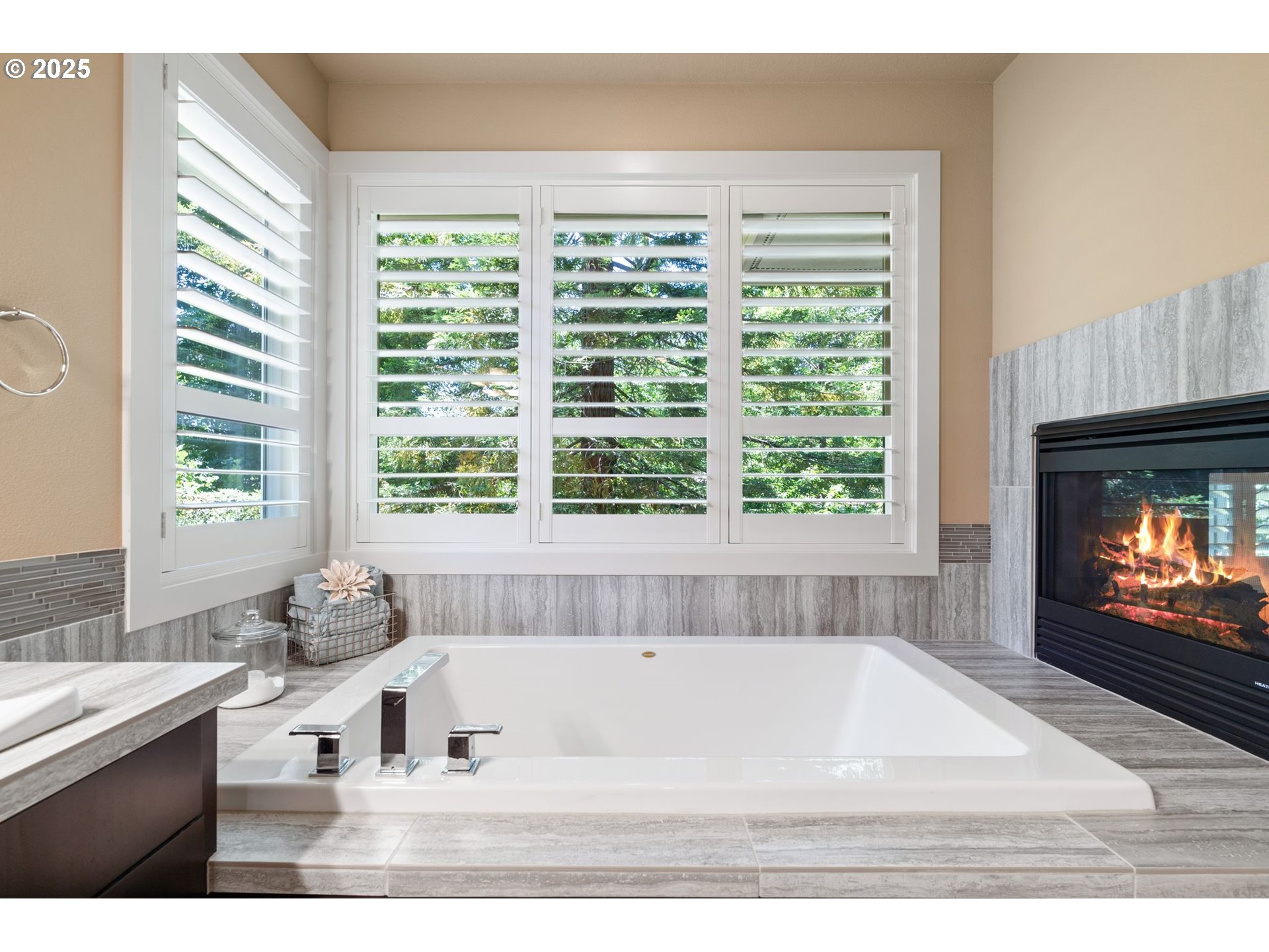 3425 Southwest 57th Avenue Portland, OR 97221 - Photo 10 of 33 a bathroom with a tub a sink and a large window
