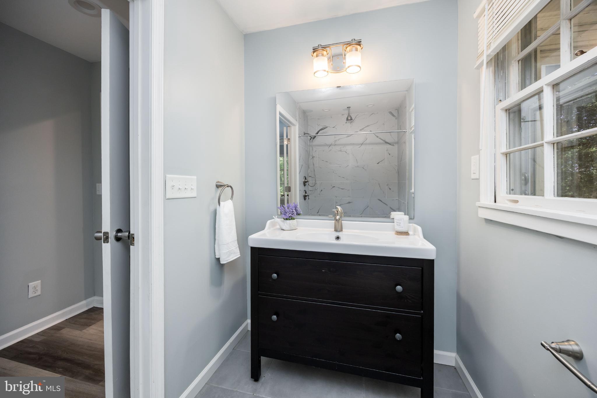 1105 Middleneck Drive Salisbury, MD 21804 - Photo 14 of 38 a room with a sink and a mirror