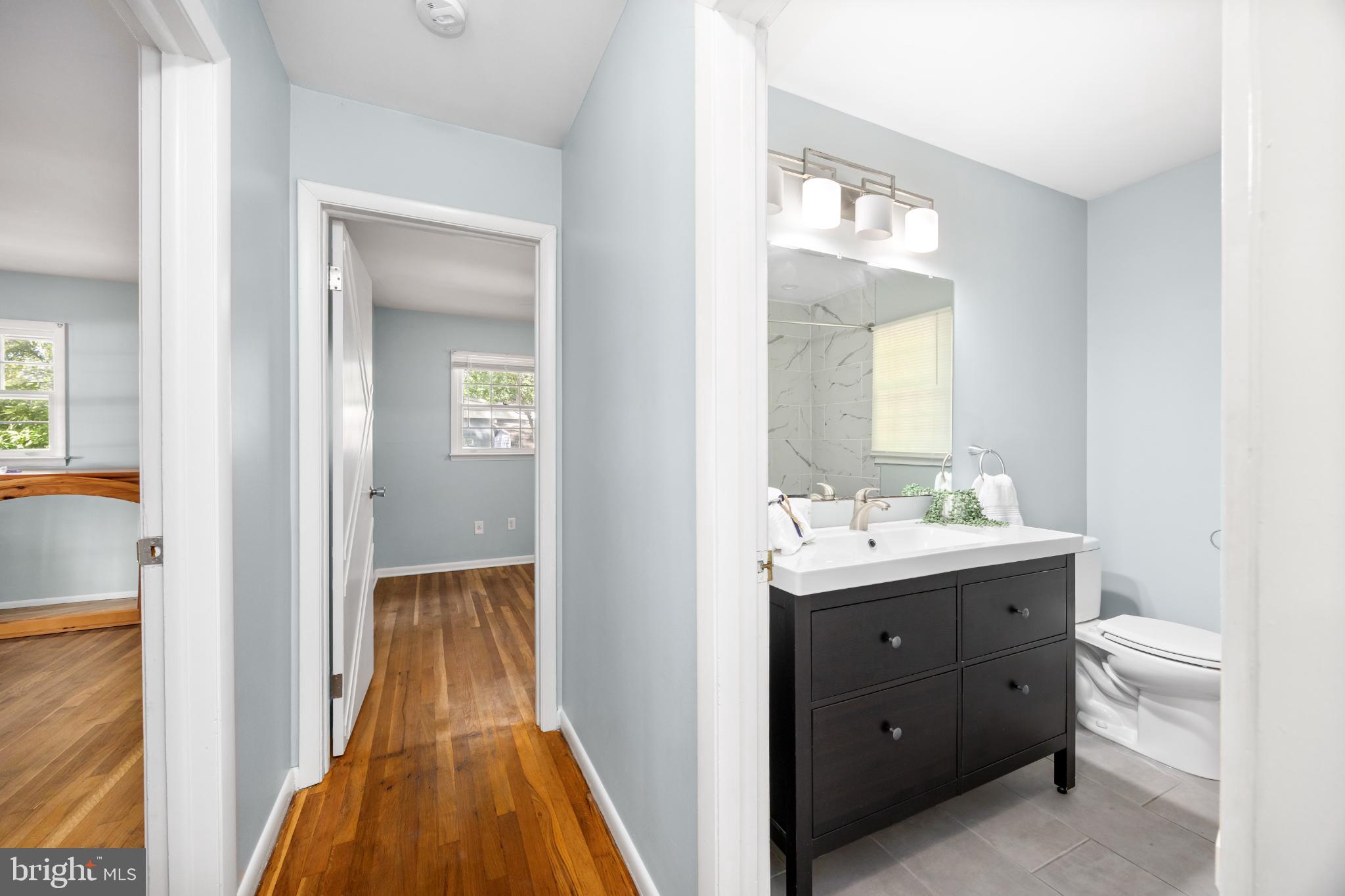 1105 Middleneck Drive Salisbury, MD 21804 - Photo 20 of 38 a en suite bathroom with a toilet sink and mirror
