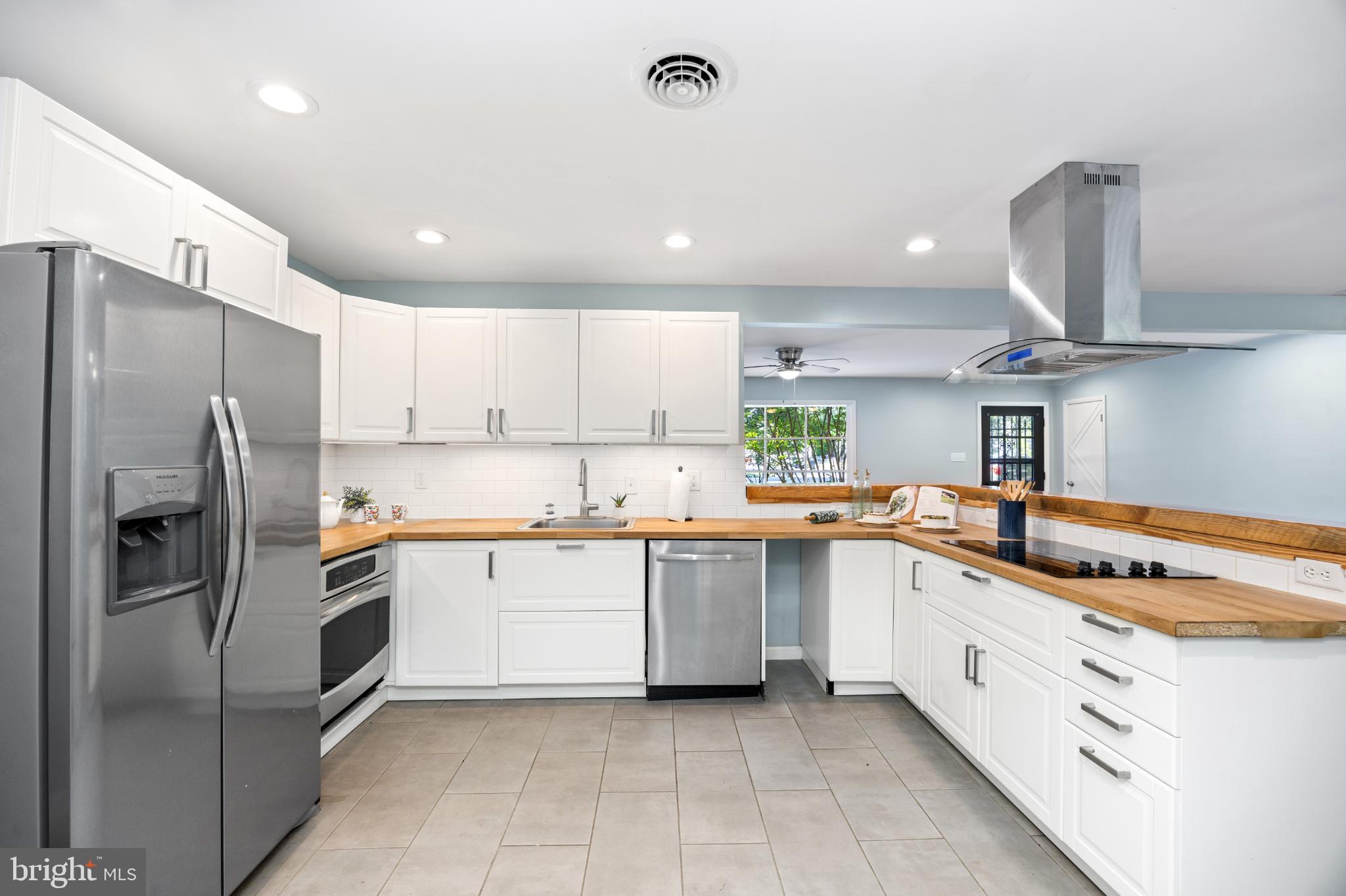 1105 Middleneck Drive Salisbury, MD 21804 - Photo 2 of 38 a kitchen with stainless steel appliances granite countertop a sink and refrigerator