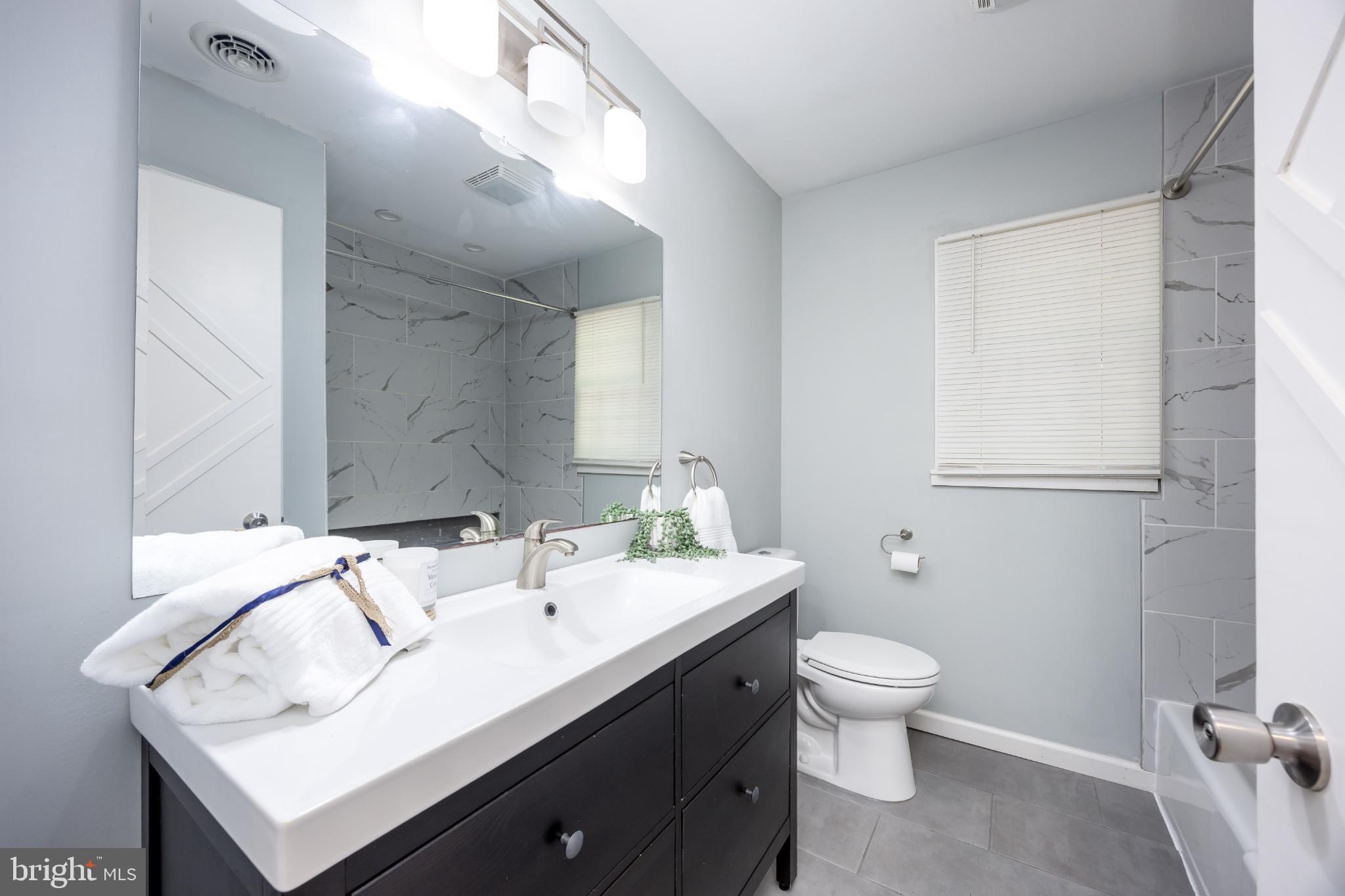 1105 Middleneck Drive Salisbury, MD 21804 - Photo 21 of 38 a bathroom with a sink toilet and mirror
