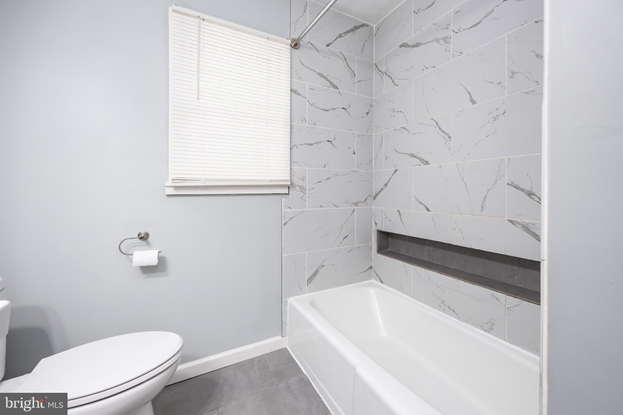 1105 Middleneck Drive Salisbury, MD 21804 - Photo 24 of 38 a bathroom with a white bath tub and a toilet