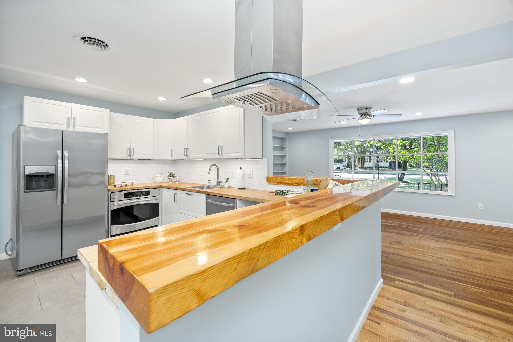 1105 Middleneck Drive Salisbury, MD 21804 - Photo 4 of 38 a large kitchen with kitchen island a large counter space stainless steel appliances and cabinets