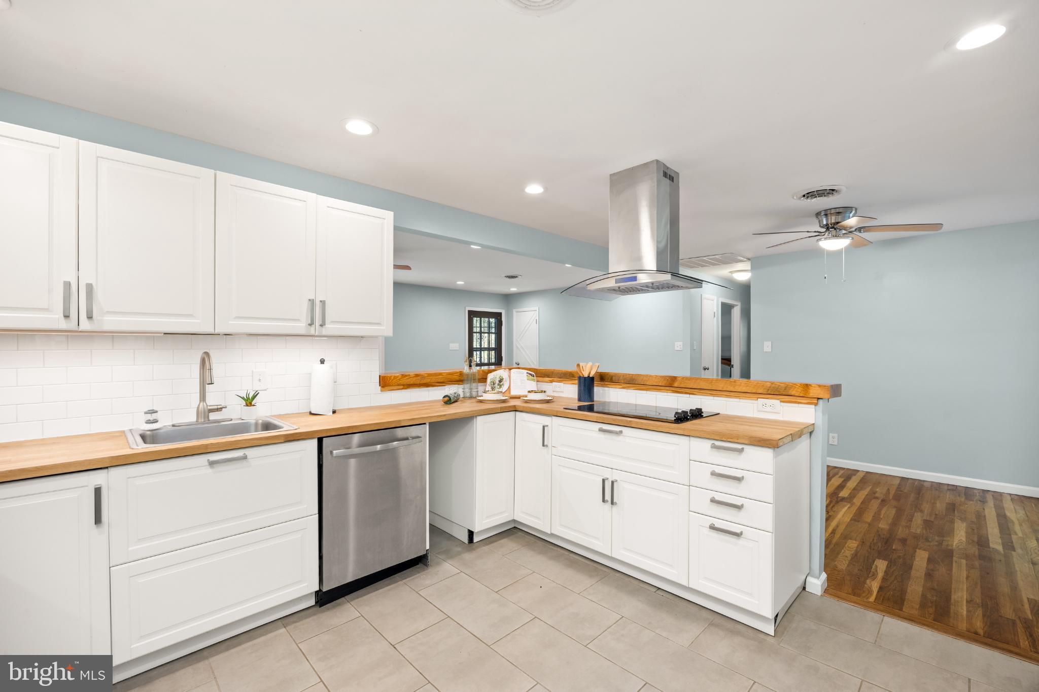 1105 Middleneck Drive Salisbury, MD 21804 - Photo 5 of 38 a kitchen with granite countertop a sink and white cabinets