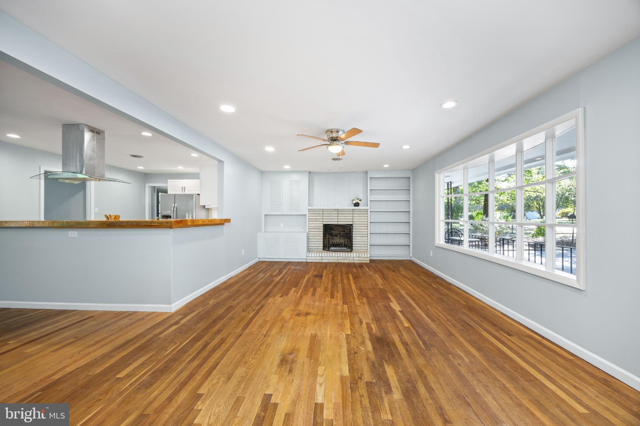 1105 Middleneck Drive Salisbury, MD 21804 - Photo 9 of 38 a view of an empty room with a kitchen and a window