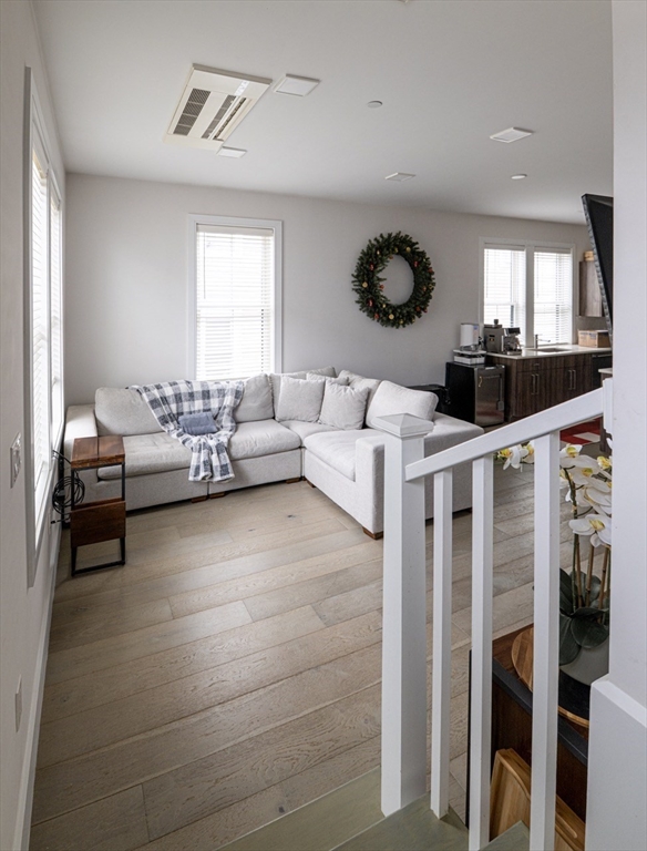 24 Rush Street, Unit I Somerville, MA 02145 - Photo 13 of 21 a living room with furniture and a large window