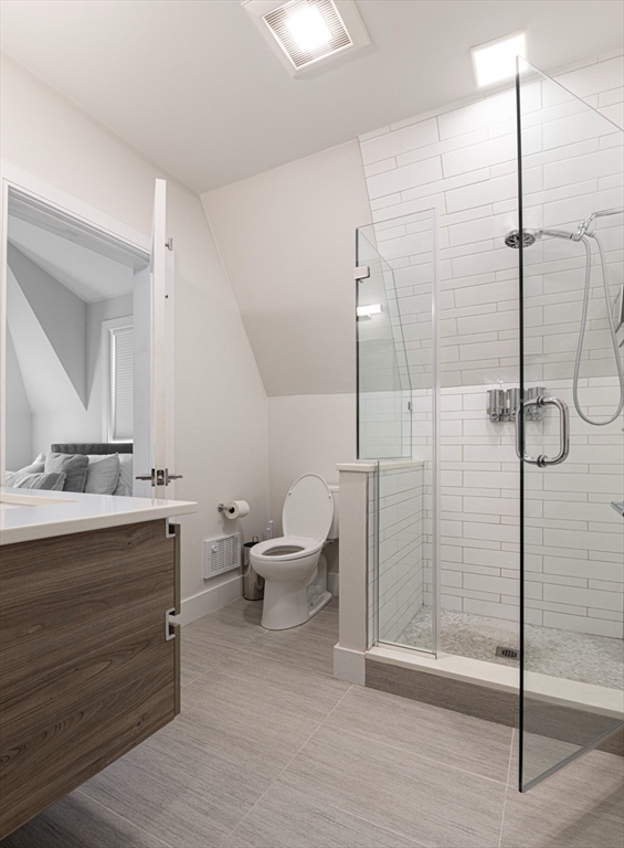 24 Rush Street, Unit I Somerville, MA 02145 - Photo 18 of 21 a bathroom with a sink and mirror