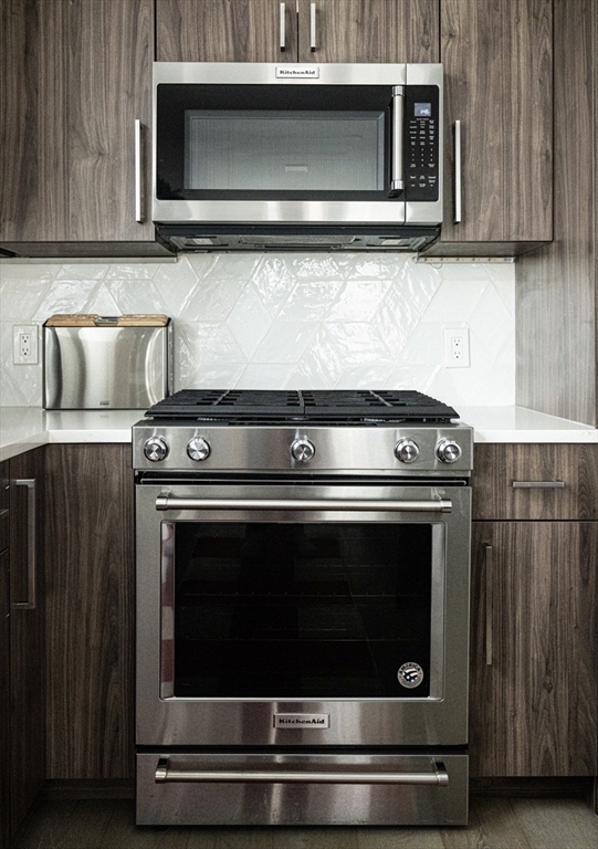 24 Rush Street, Unit I Somerville, MA 02145 - Photo 6 of 21 a stove top oven sitting inside of a kitchen