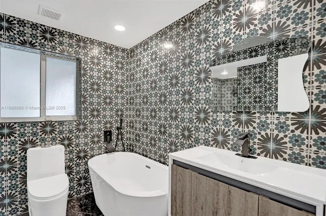 a spacious bedroom with a bed and a chair