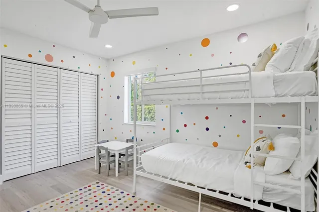 a view of a patio with table and chairs with wooden floor and fence
