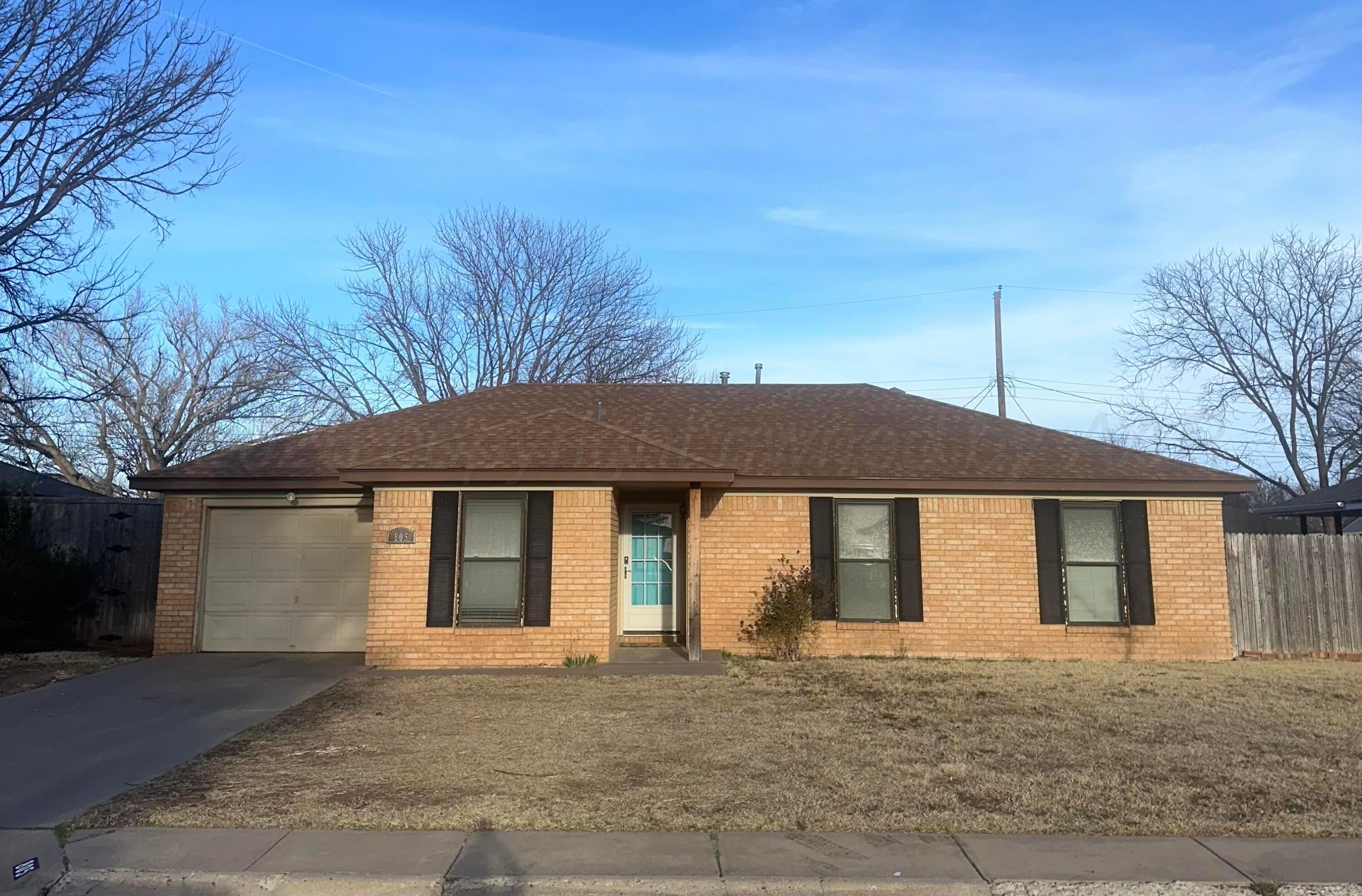 805 Oregon Trail Canyon, TX 79015 - Photo 1 of 14 a front view of a house with a garden