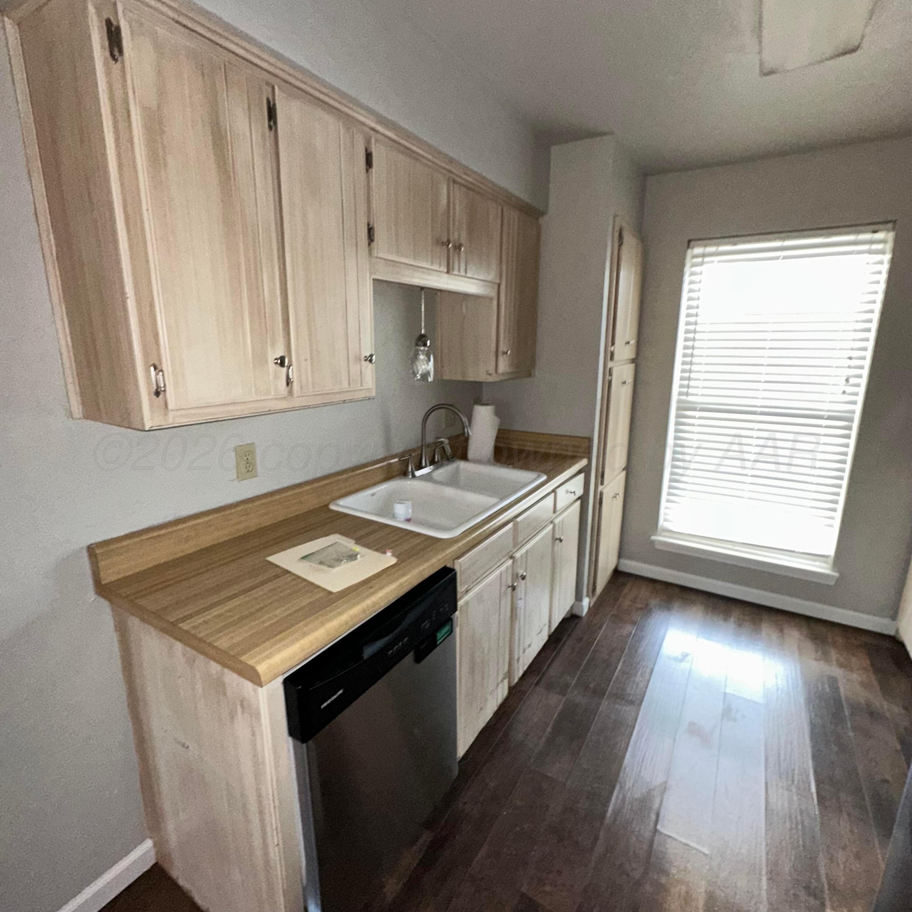 805 Oregon Trail Canyon, TX 79015 - Photo 5 of 14 a kitchen with a sink stove and cabinets