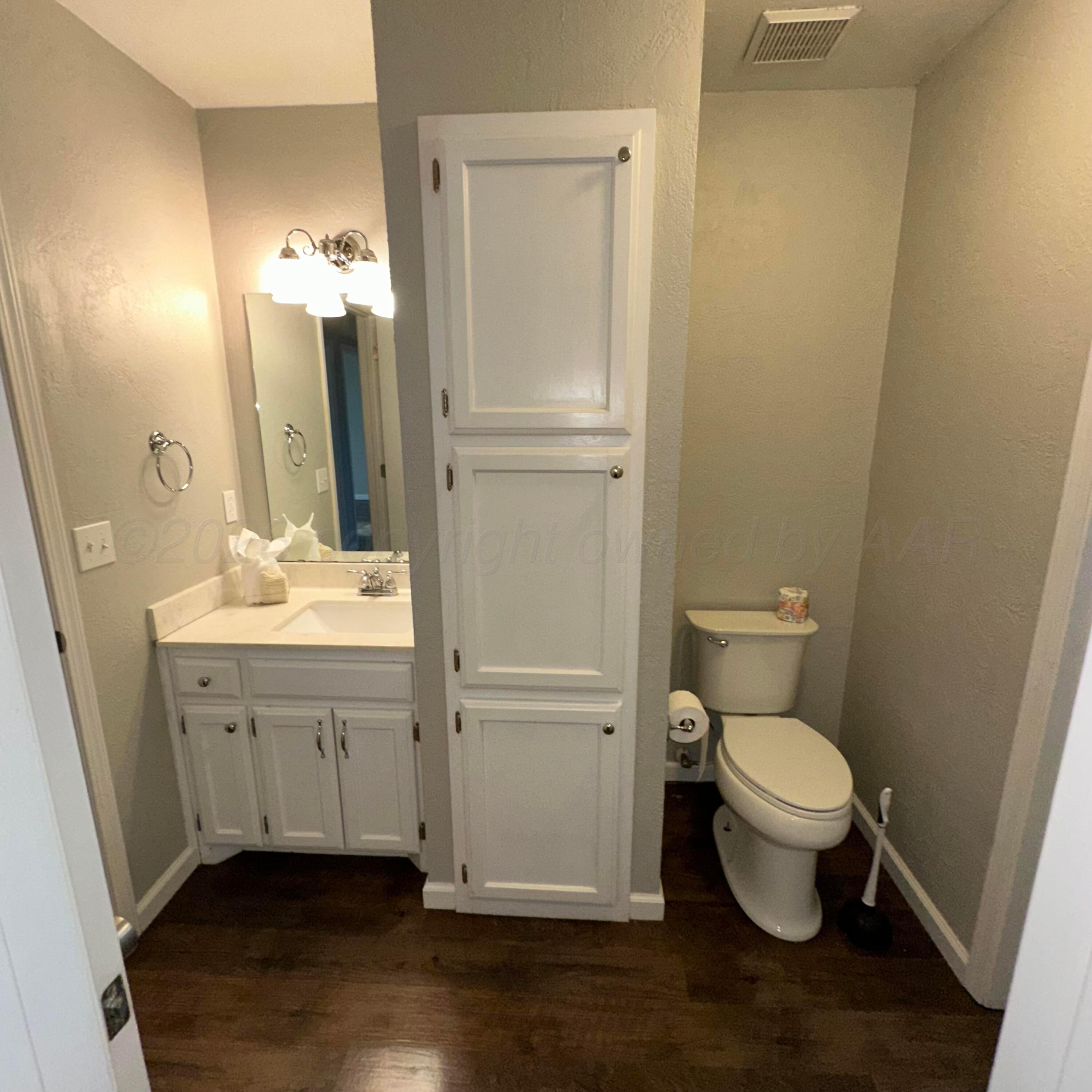 805 Oregon Trail Canyon, TX 79015 - Photo 7 of 14 a bathroom with a sink a toilet and shower