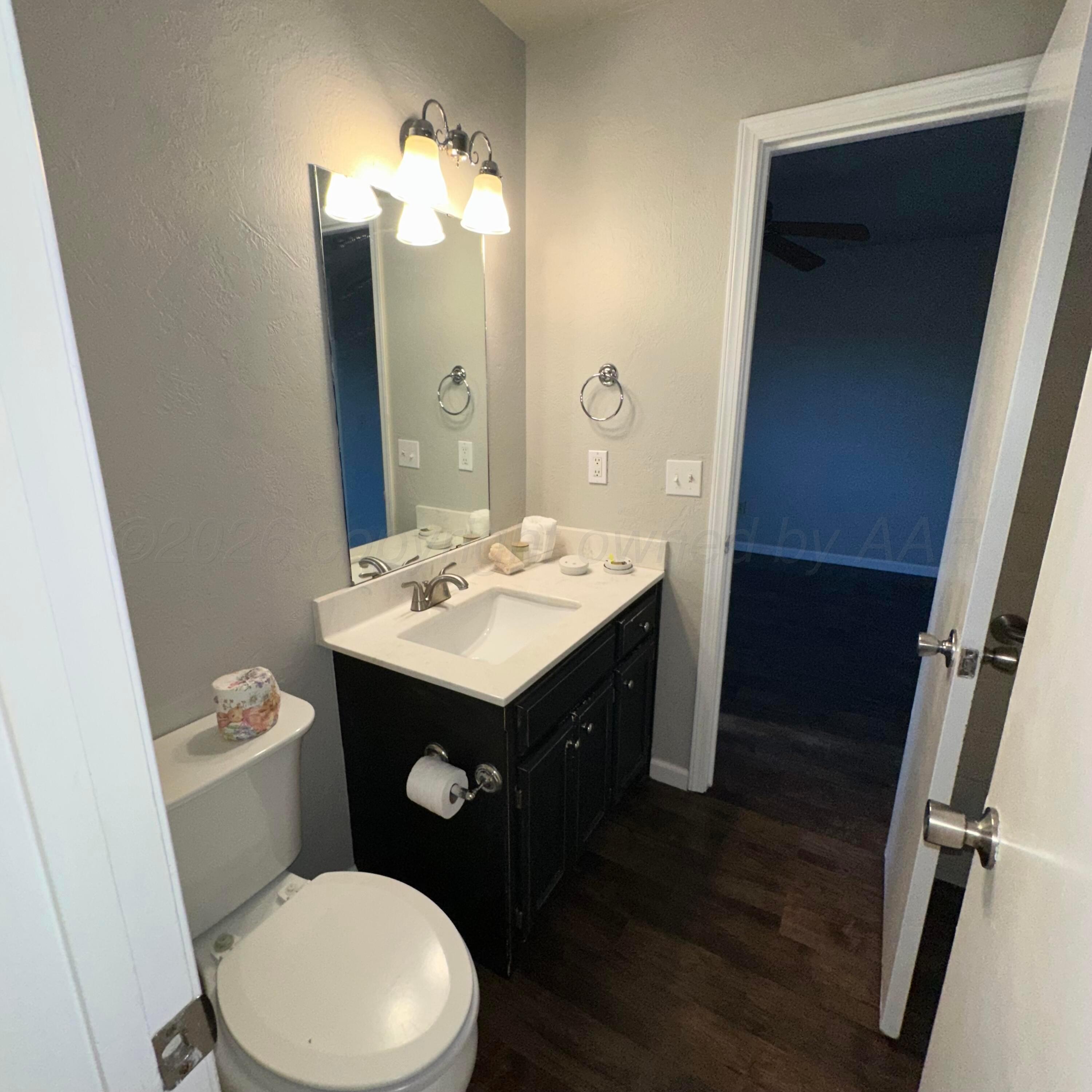 805 Oregon Trail Canyon, TX 79015 - Photo 8 of 14 a bathroom with a sink toilet and mirror