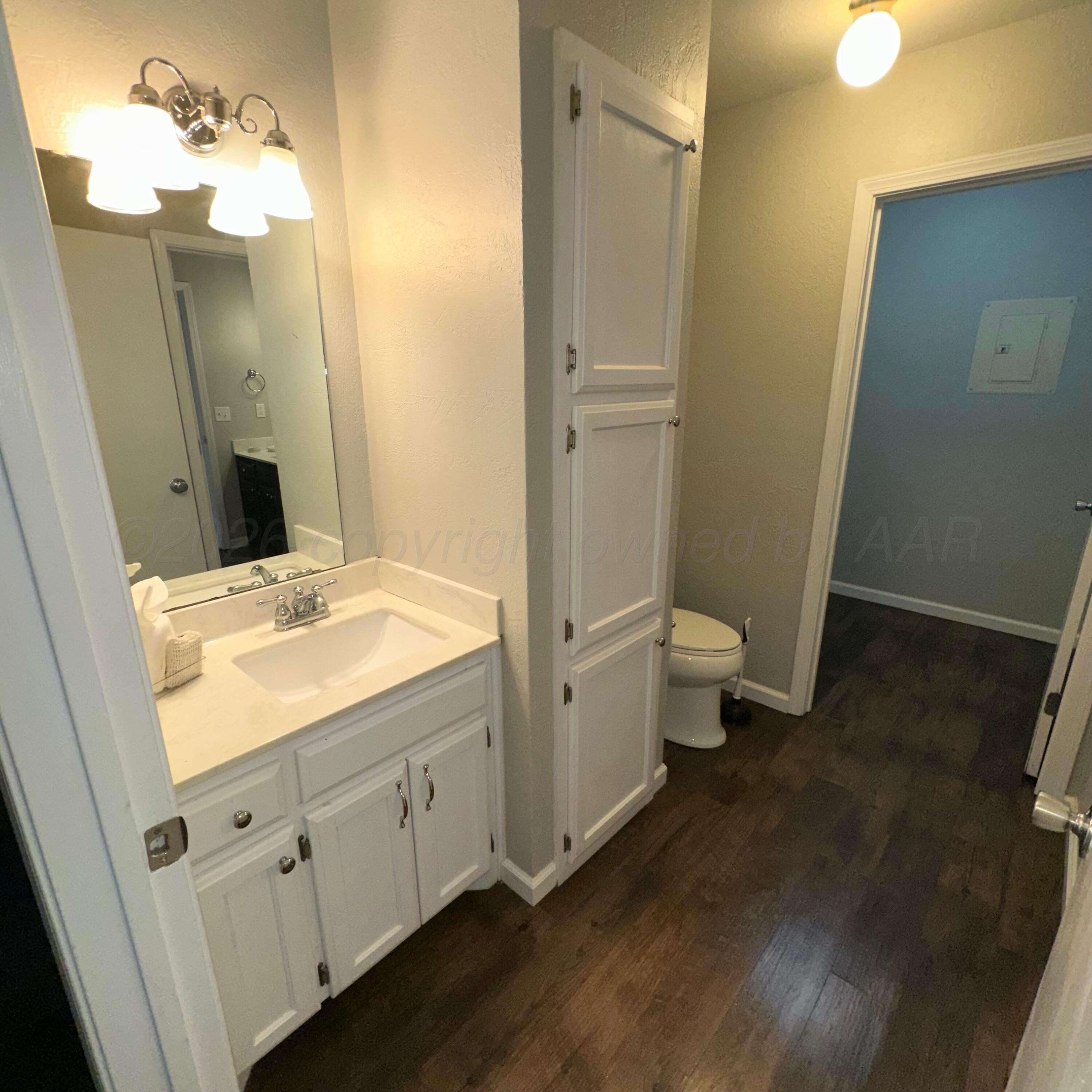 805 Oregon Trail Canyon, TX 79015 - Photo 9 of 14 a bathroom with a double vanity sink and mirror