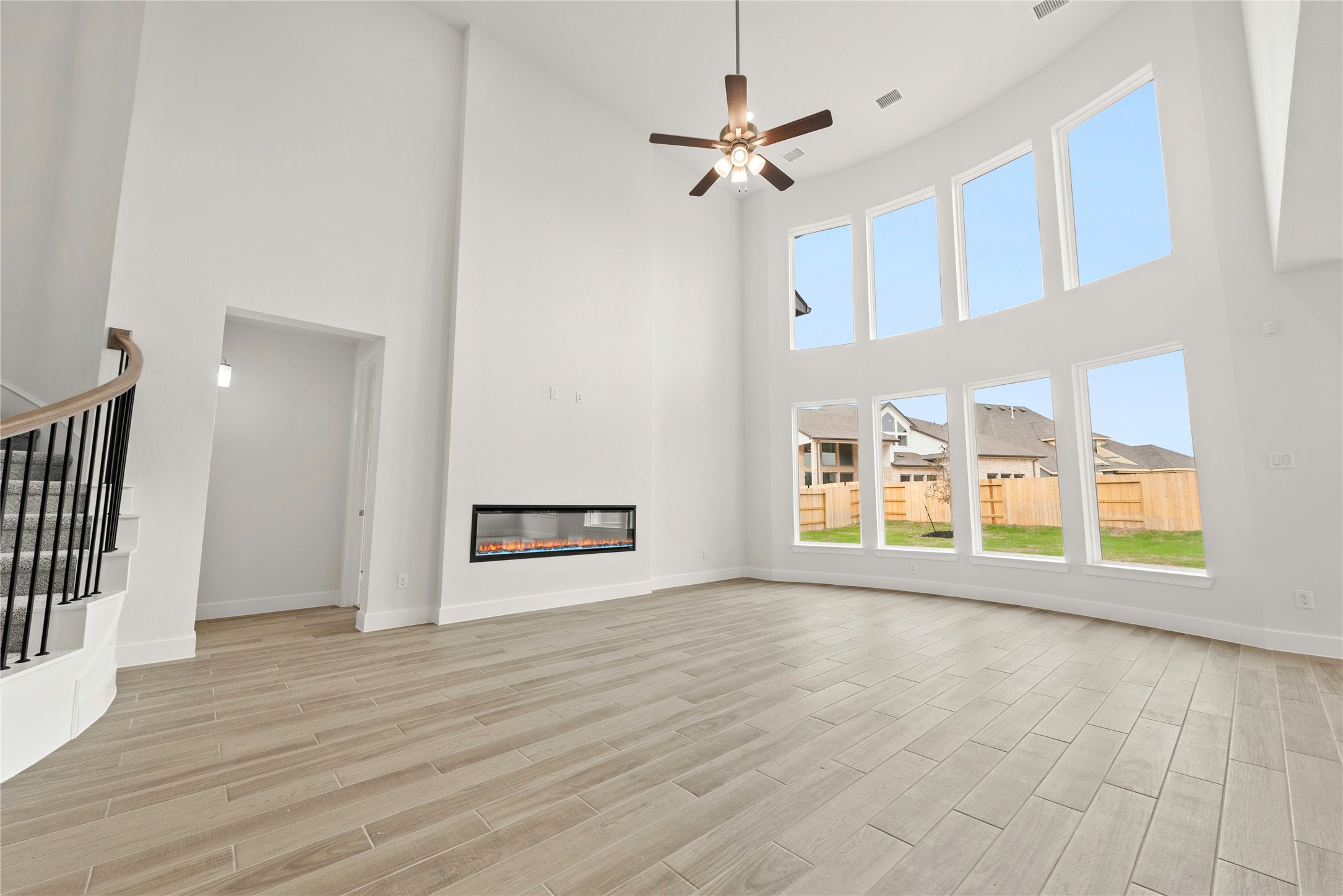 18917 Moonriver Street Conroe, TX 77302 - Photo 4 of 28 a view of an empty room with a window and wooden floor