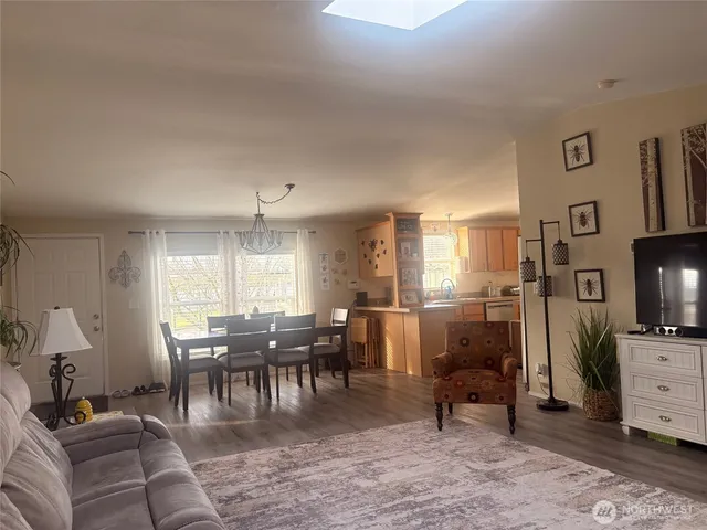 a view of a livingroom with furniture window and wooden floor