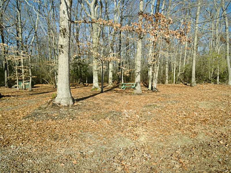 48 Maxson Hill Road Hopkinton, RI 02804 - Photo 15 of 18 Exterior Back. An expansive outdoor playground awaits you for horseshoes, snowmobiling, ATVs, horses, outdoor fireplace