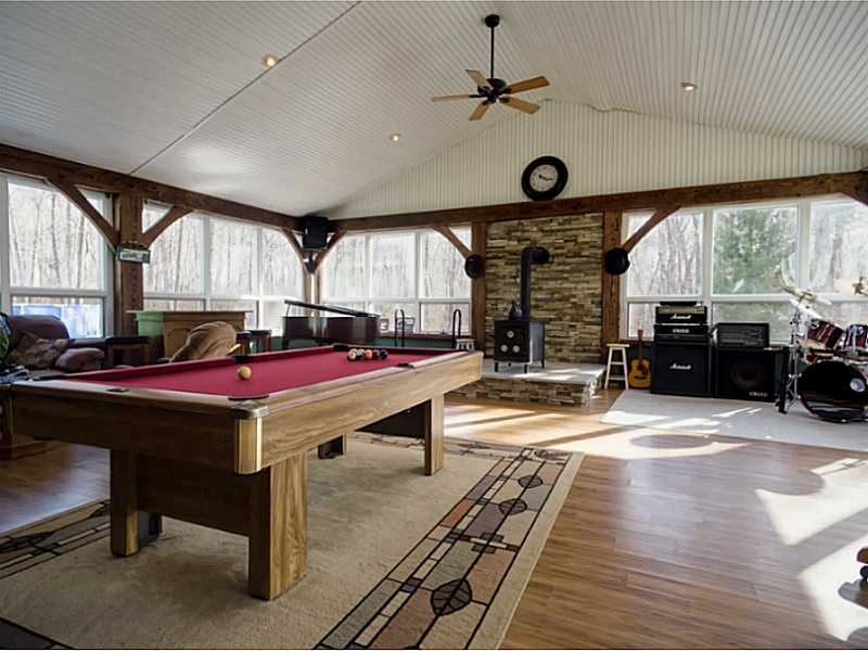 48 Maxson Hill Road Hopkinton, RI 02804 - Photo 5 of 18 Bonus Room. 1,000 plus square feet great room with wood stove, massive ceilings, and large windows throughout