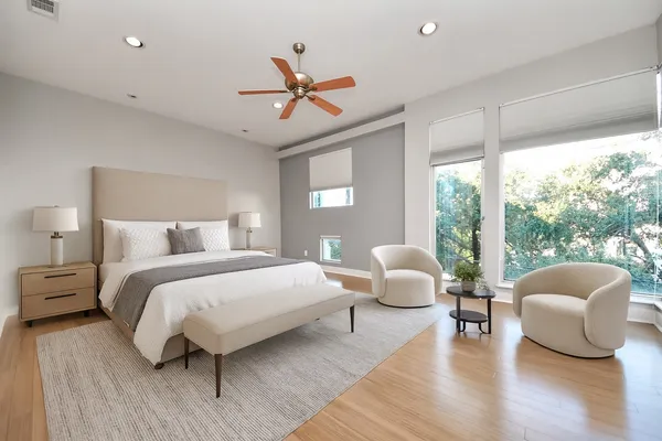 a bedroom with a bed and a couch