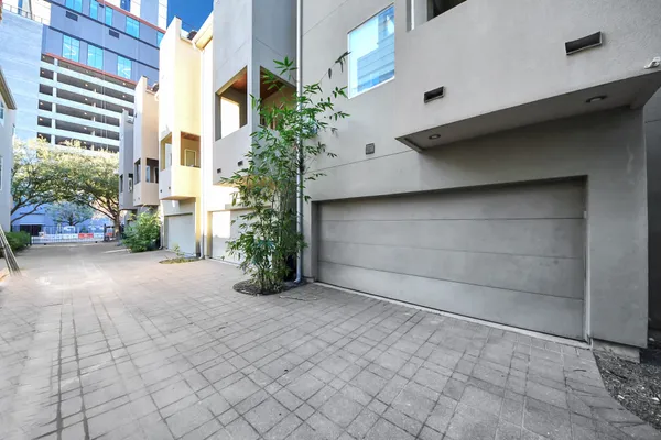a view of parking space garage and yard