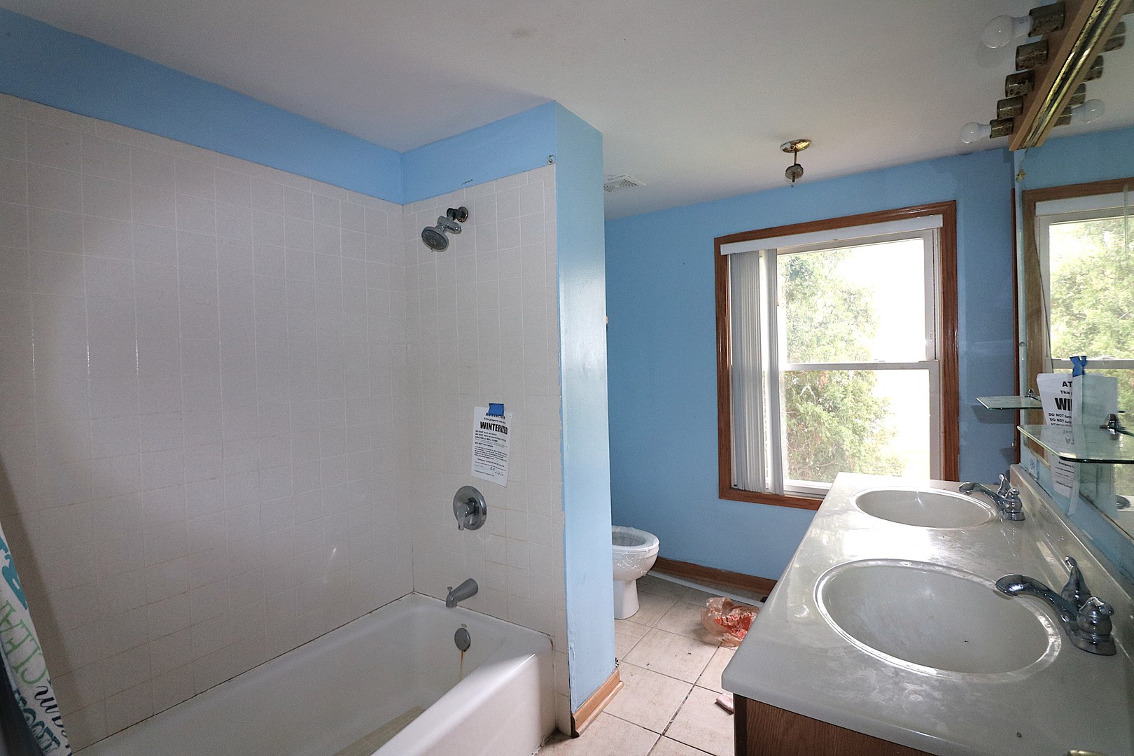 319 Dean Circle Bolingbrook, IL 60440 - Photo 6 of 11 a bath room with a sink toilet and tub