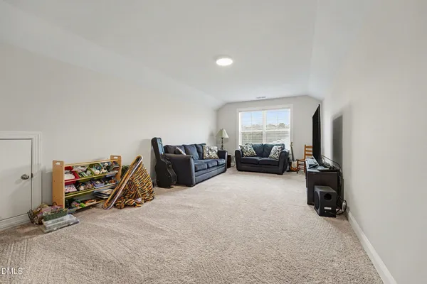 a bed room with furniture and a gym machine