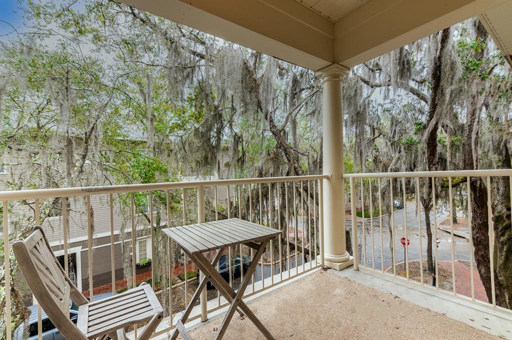 4850 Southwest 91 Terrace, Unit 301 Gainesville, FL 32608 - Photo 17 of 24 a view of a balcony with furniture
