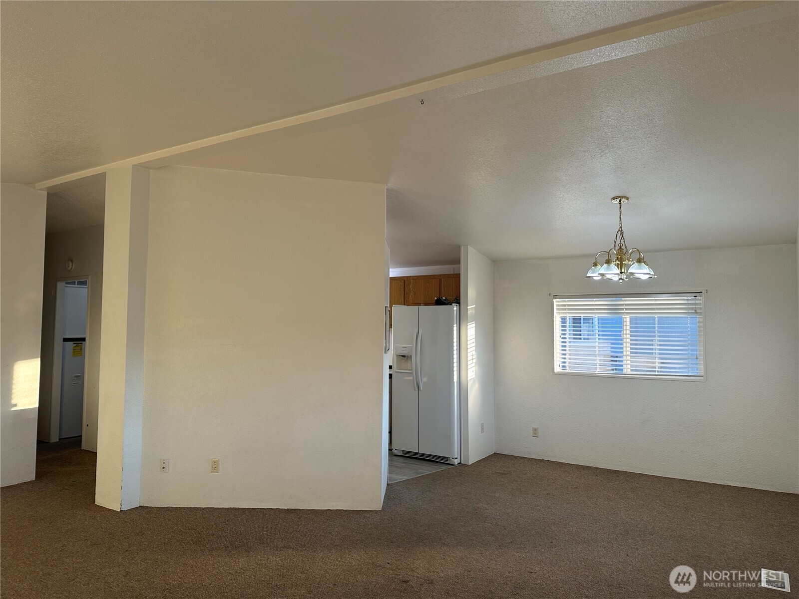571 Morning View Circle East Wenatchee, WA 98802 - Photo 4 of 9 an empty room with chandelier fan and windows