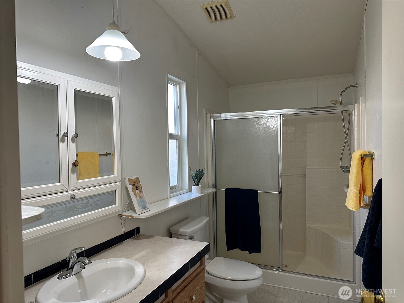571 Morning View Circle East Wenatchee, WA 98802 - Photo 7 of 9 a bathroom with a sink toilet and shower