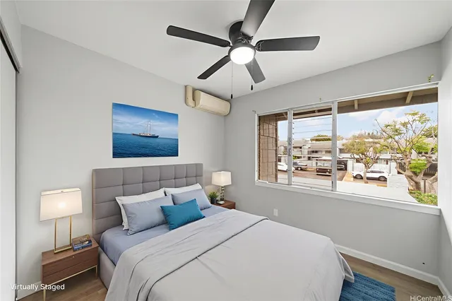 a bedroom with a large bed and a window