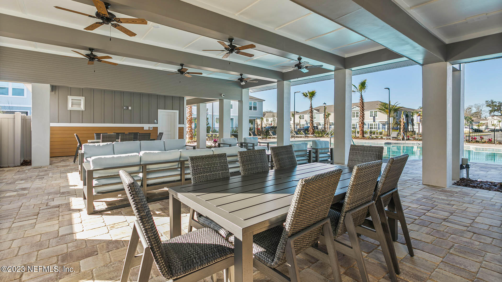 8382 Retrograde Road Jacksonville, FL 32256 - Photo 22 of 33 a dining room with furniture a chandelier and wooden floor