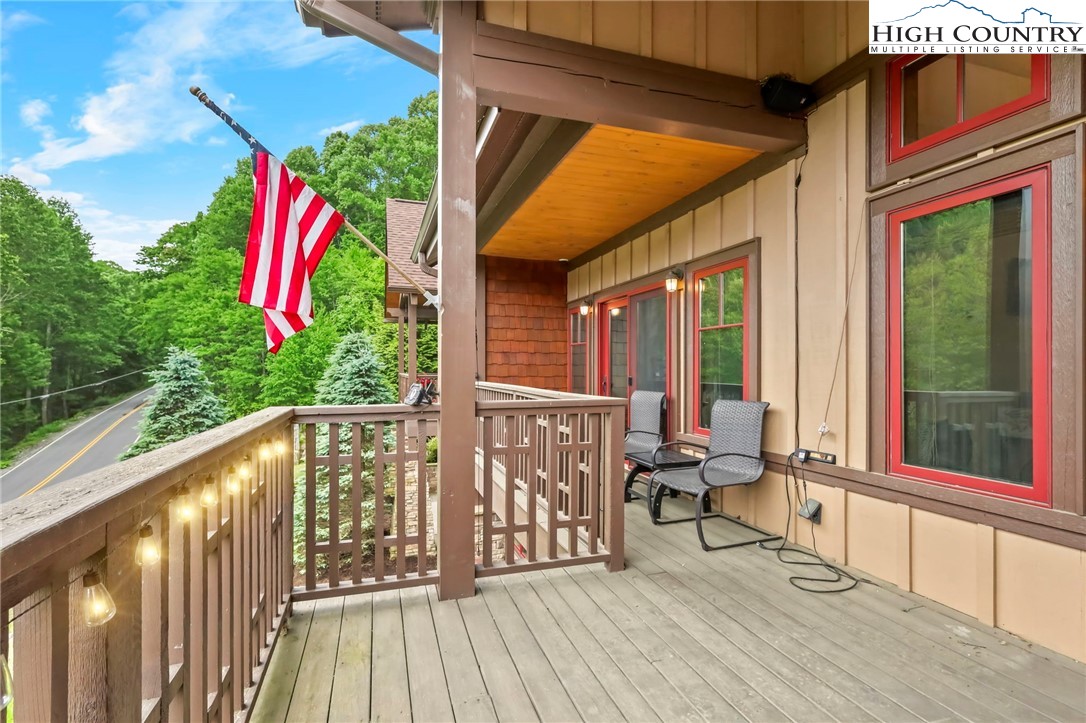 138 South Camp Road, Unit 103 Boone, NC 28607 - Photo 27 of 50 a balcony view with two chairs and a large window