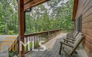 107 Chestnut Valley Blue Ridge, GA 30513 - Photo 1 of 1 a view of balcony with wooden floor and fence