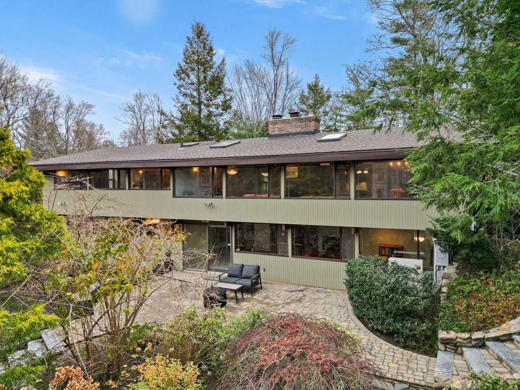 76 Hillside Road North Andover, MA 01845 - Photo 1 of 42 a front view of a house with table and chairs