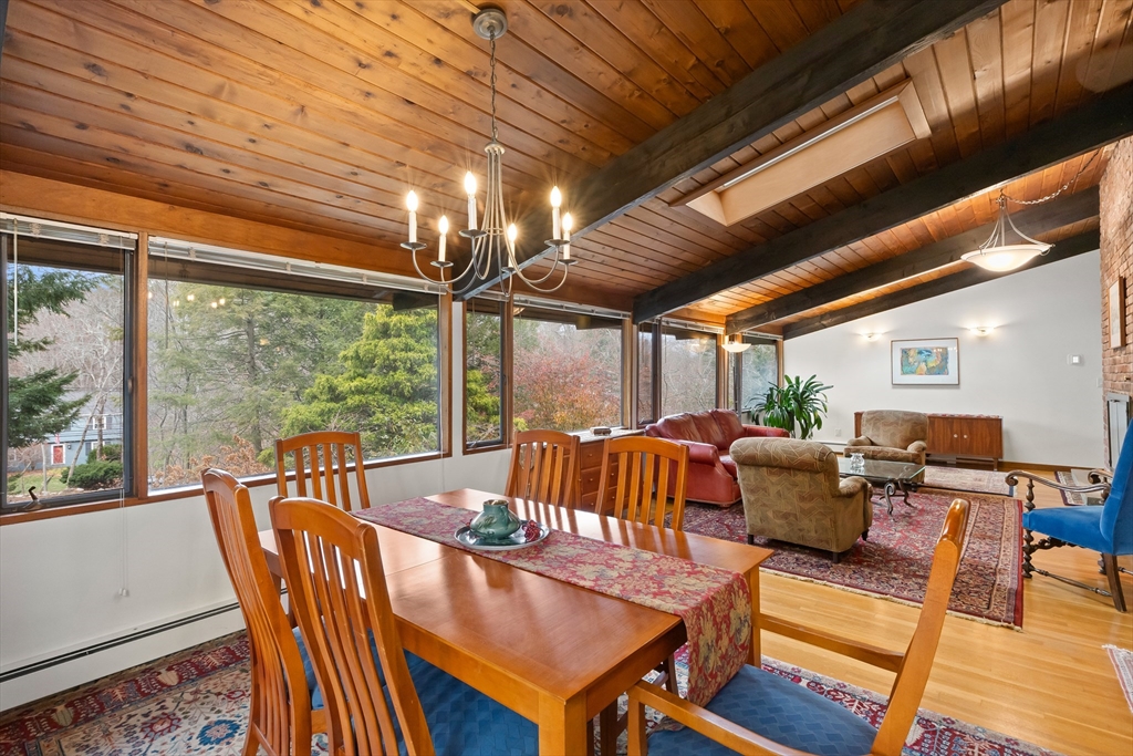76 Hillside Road North Andover, MA 01845 - Photo 18 of 42 a outdoor dining space with furniture and wooden floor