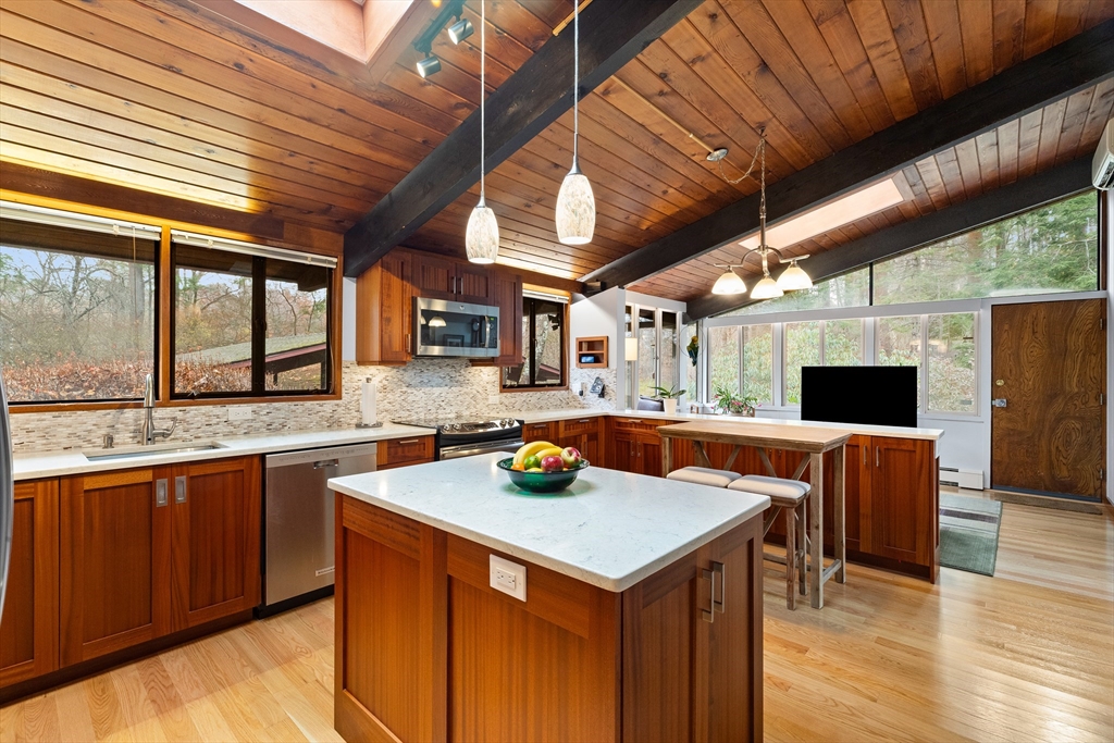 76 Hillside Road North Andover, MA 01845 - Photo 19 of 42 a kitchen with a stove a sink dishwasher and a refrigerator with wooden floor