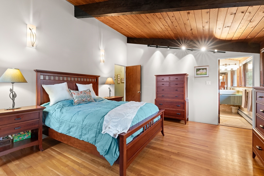 76 Hillside Road North Andover, MA 01845 - Photo 27 of 42 a bedroom with a bed and wooden floor