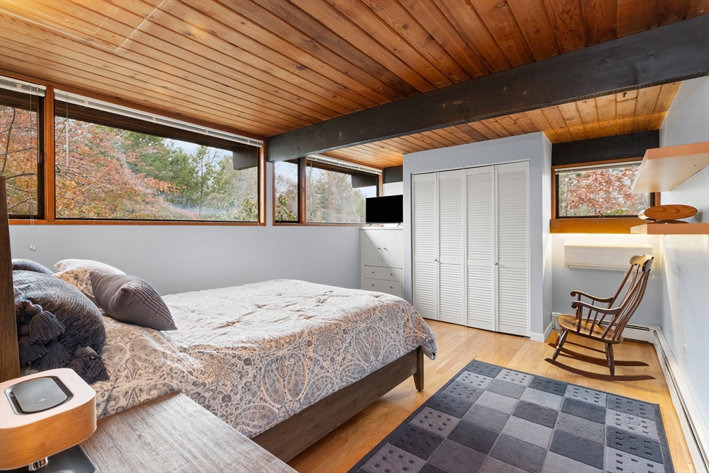 76 Hillside Road North Andover, MA 01845 - Photo 38 of 42 a bedroom with a bed and large windows