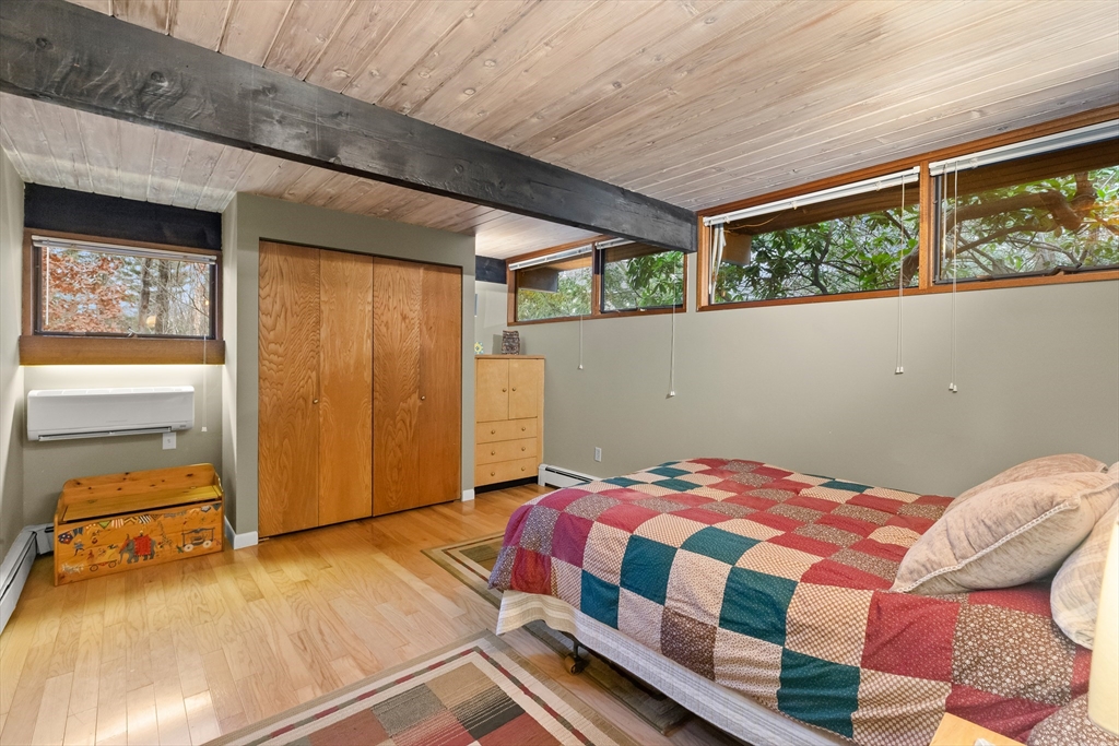 76 Hillside Road North Andover, MA 01845 - Photo 39 of 42 a bedroom with a bed and wooden floor