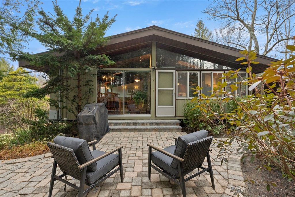 76 Hillside Road North Andover, MA 01845 - Photo 7 of 42 a view of a house with a yard and sitting area