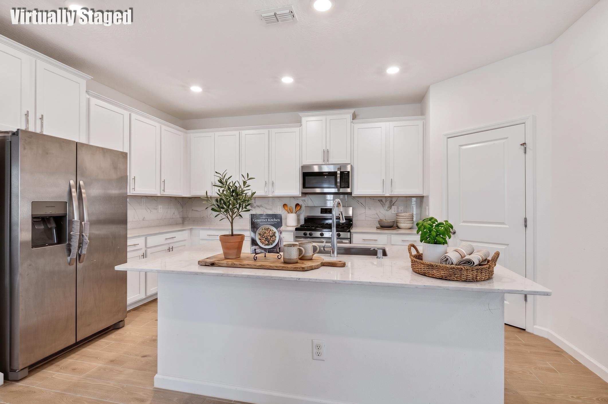 210 White Rabbit Run St. Augustine, FL 32092 - Photo 6 of 85 a kitchen with kitchen island granite countertop a sink cabinets and stainless steel appliances