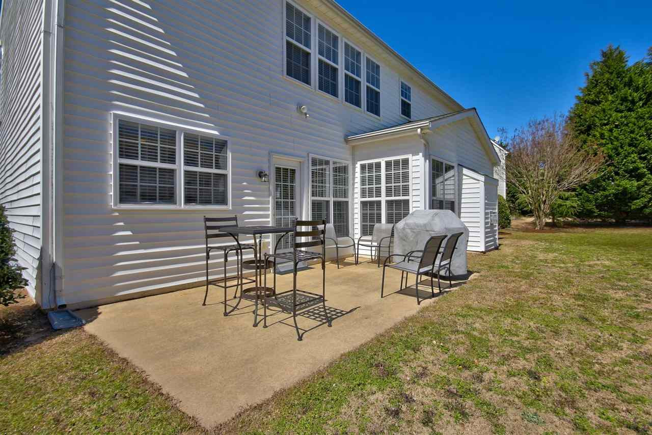 7616 Derek Drive Raleigh, NC 27613 - Photo 22 of 25 Large patio is great for grilling out! Host a neighborhood barbecue and get to know your new neighbors on the cul de sac! Exterior Back
