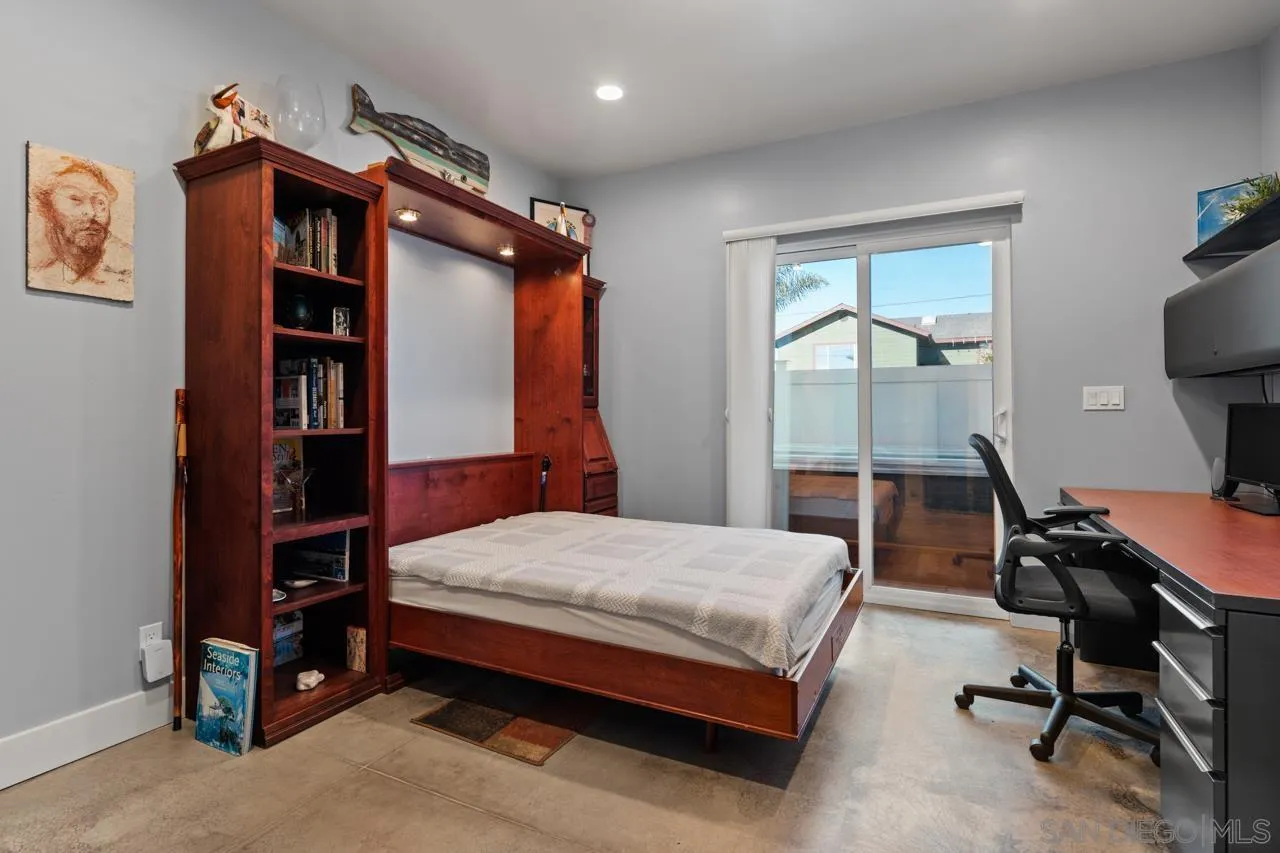 413 Delaware Street Imperial Beach, CA 91932 - Photo 11 of 37 a bedroom with a bed and a desk