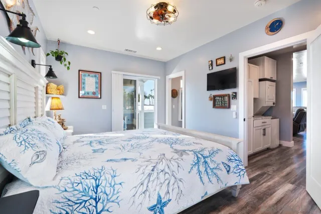 a bedroom with a large bed and a window