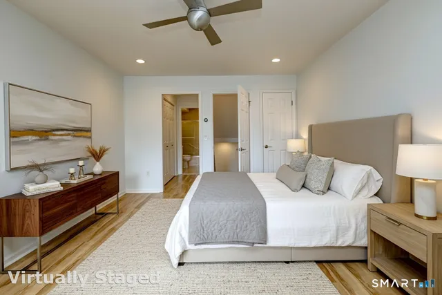 a bedroom with a bed and a dresser