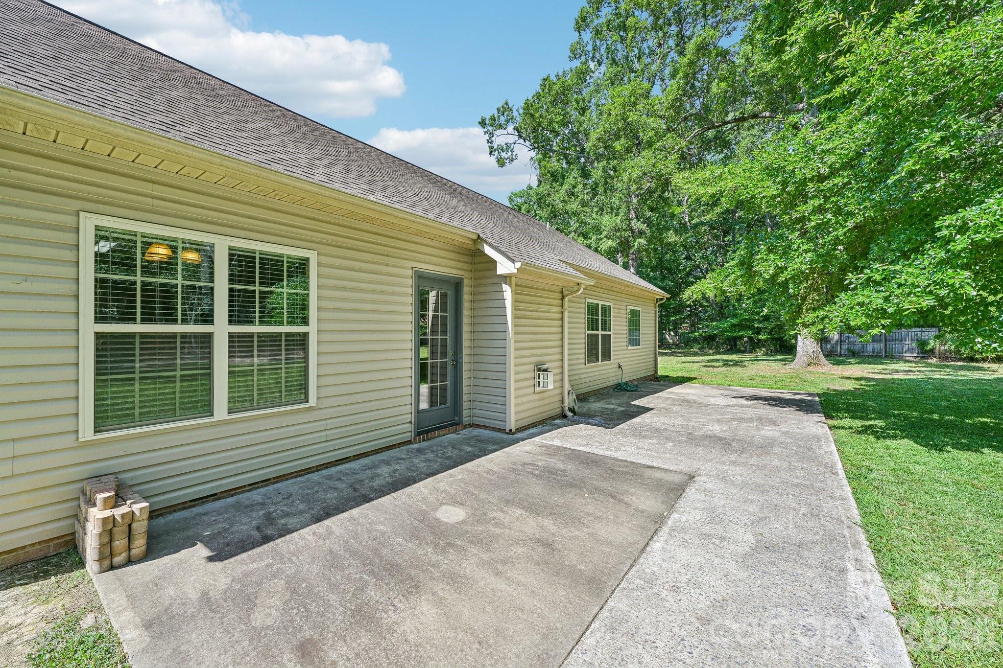 624 Hunley Street Monroe, NC 28112 - Photo 27 of 36 a front view of a house with a yard and garage