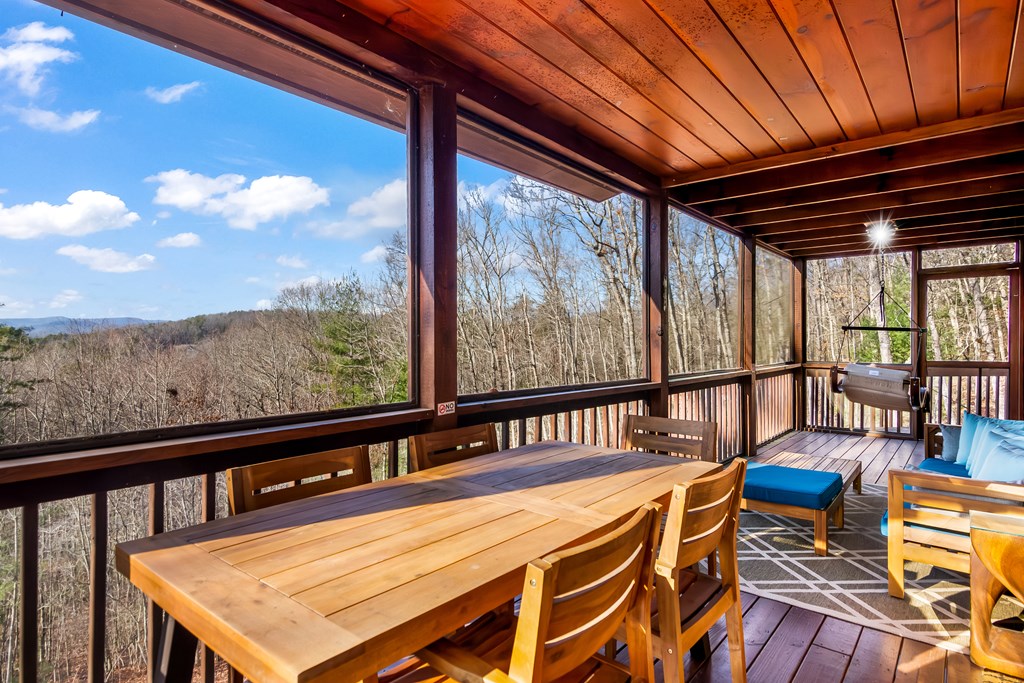 249 Sugar Mountain Road Blue Ridge, GA 30513 - Photo 32 of 61 a view of a balcony with furniture